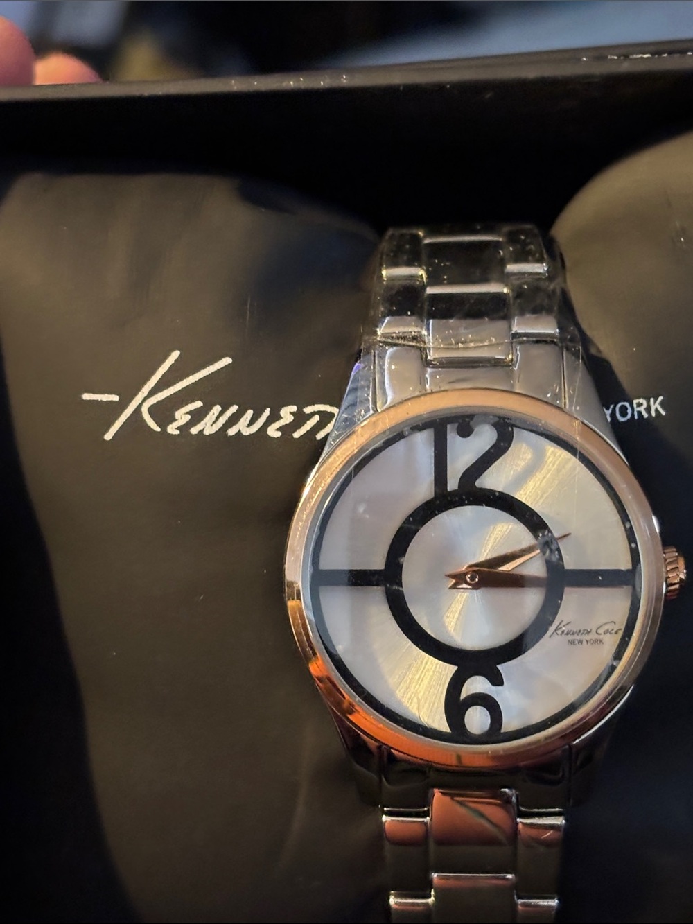 Kenneth Cole Silver Watch with Rose Gold Bezel and Black Dial Accents